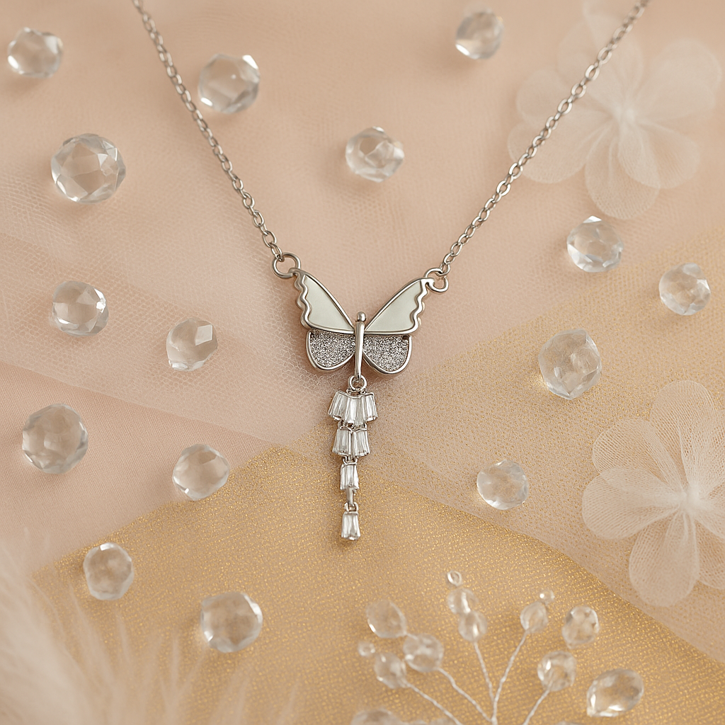 Silver butterfly with crystal wings and a drop charm