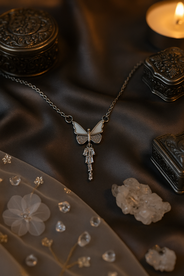 Silver butterfly with crystal wings and a drop charm
