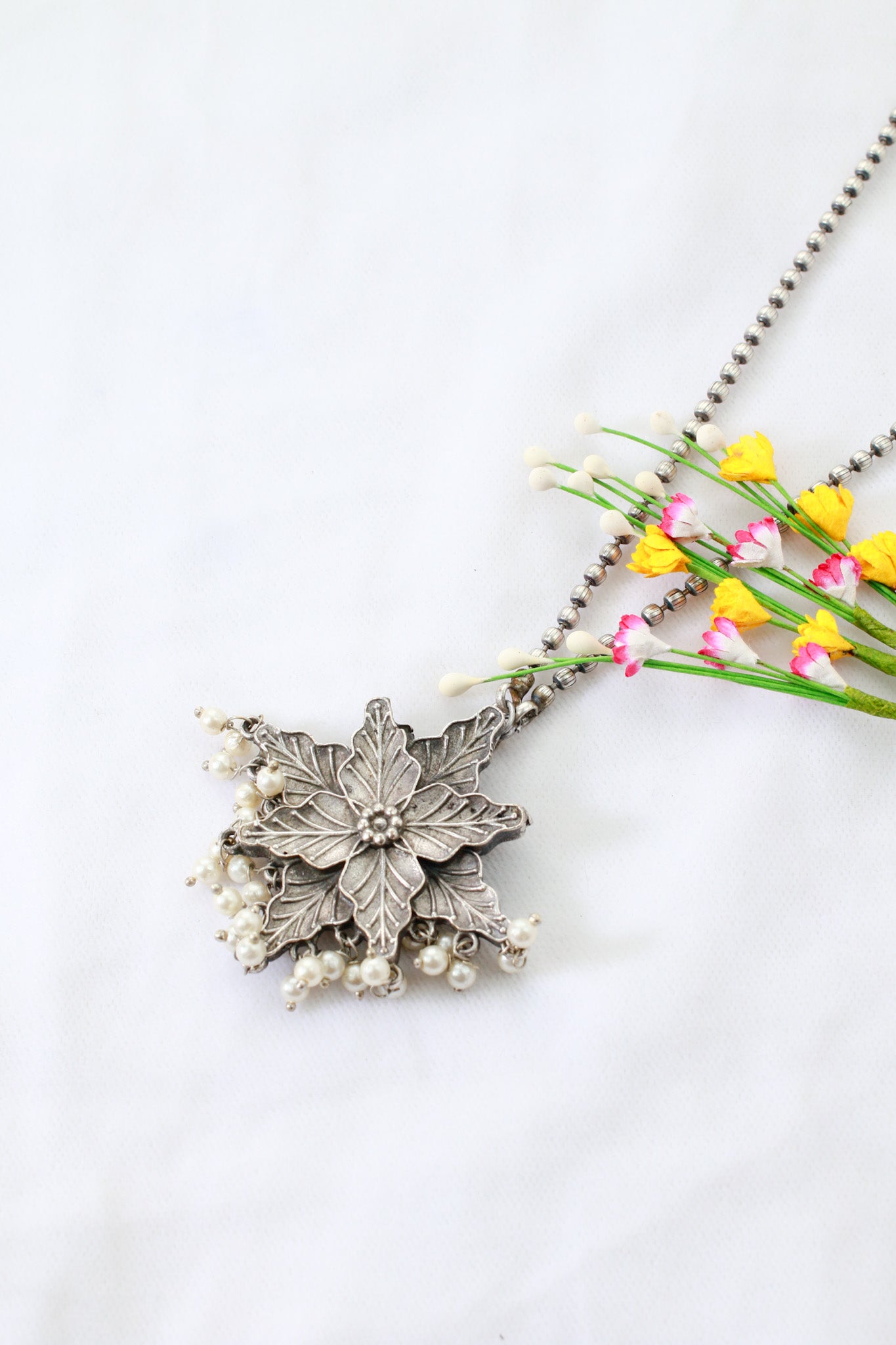 Oxidised Floral Star Pendant with Pearl Tassels | German Silver
