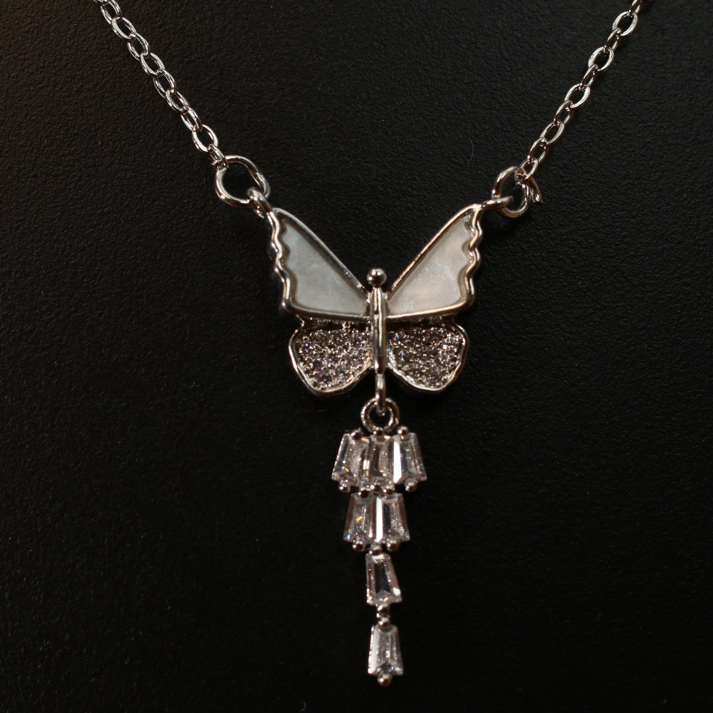 Silver butterfly with crystal wings and a drop charm