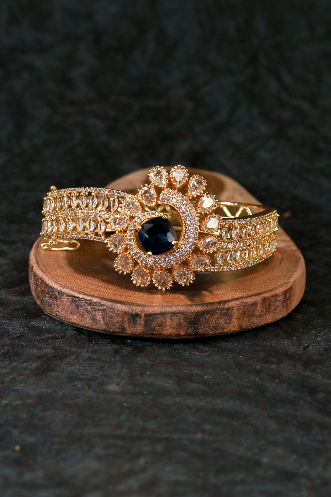 Gold Bracelet with Peacock Design and Blue Stone