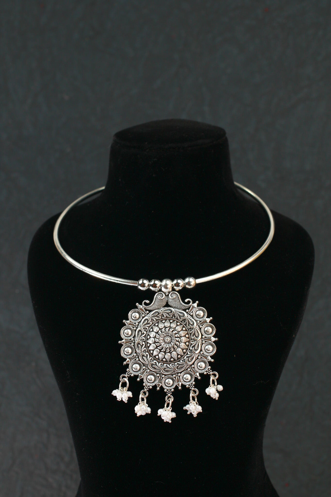 Oxidised German Silver Hansli Necklace with Ornate Floral Disc Pendant