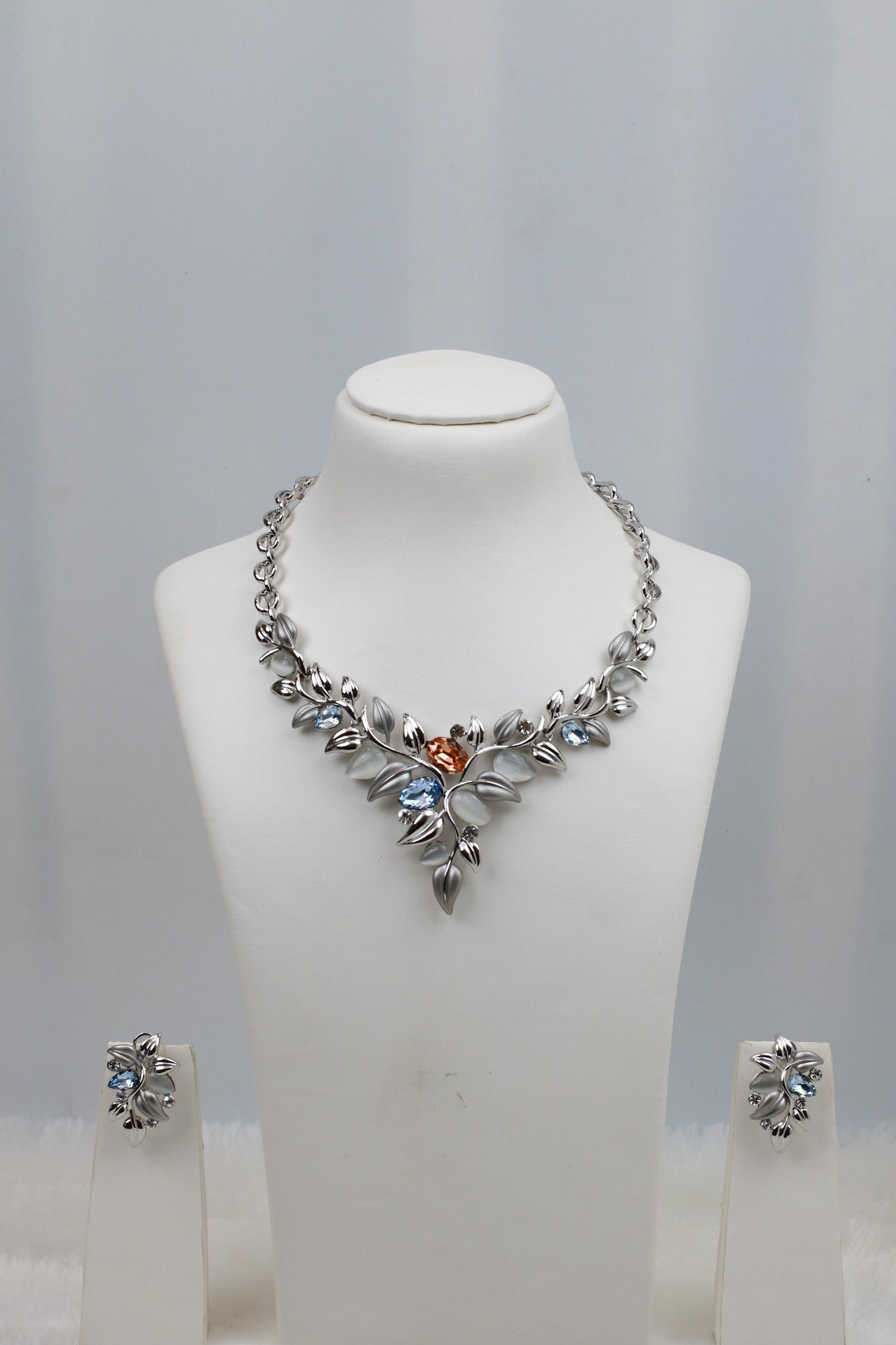 Rhodium Plated Leaf Motif AD Stone Necklace Set with Blue Accents | Silver Finish | Anti‑Tarnish - Maxiblink