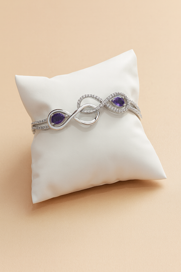 Infinity-Inspired Silver Bracelet with Dual Purple Stones