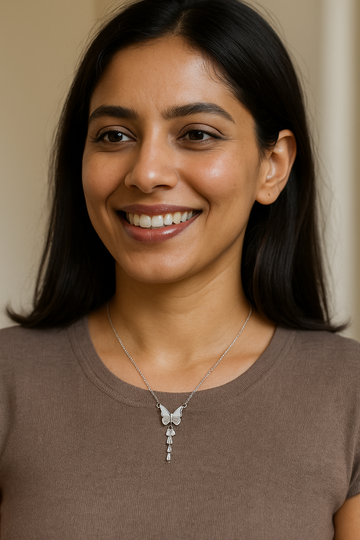 Silver butterfly with crystal wings and a drop charm