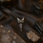 Silver butterfly with crystal wings and a drop charm