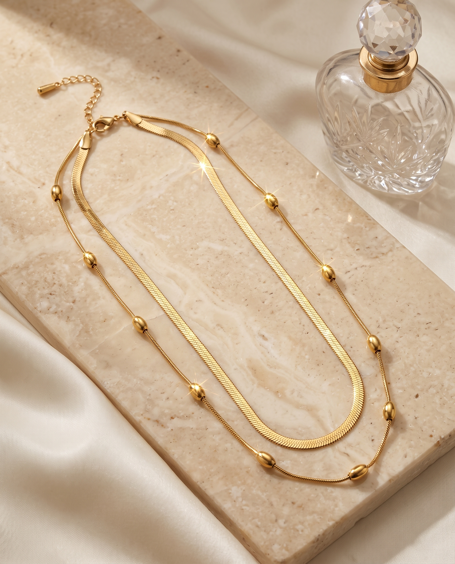 Layered snake chain necklace and earrings set, gold plated, waterproof – styled on jewelry stand