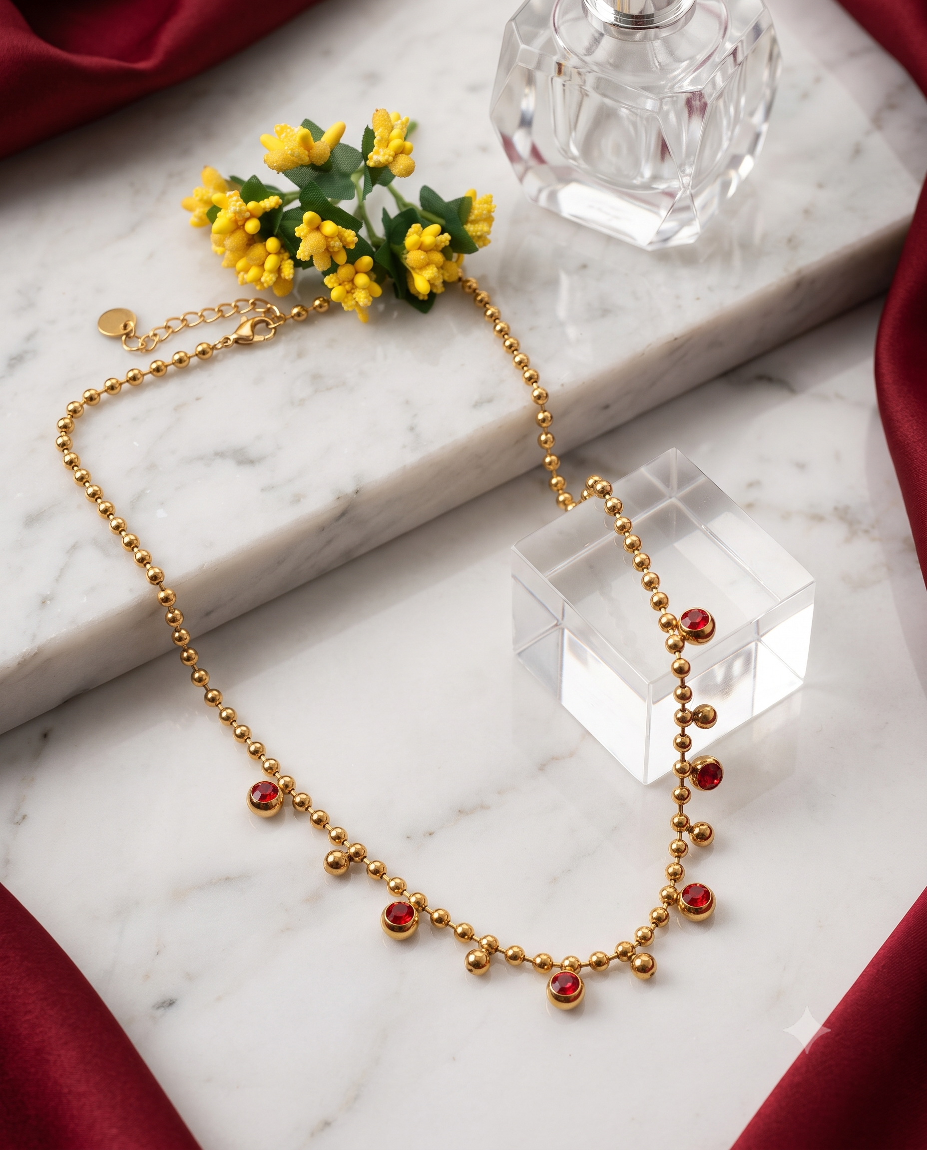 Red crystal ball chain necklace, gold plated titanium steel – styled on jewelry stand