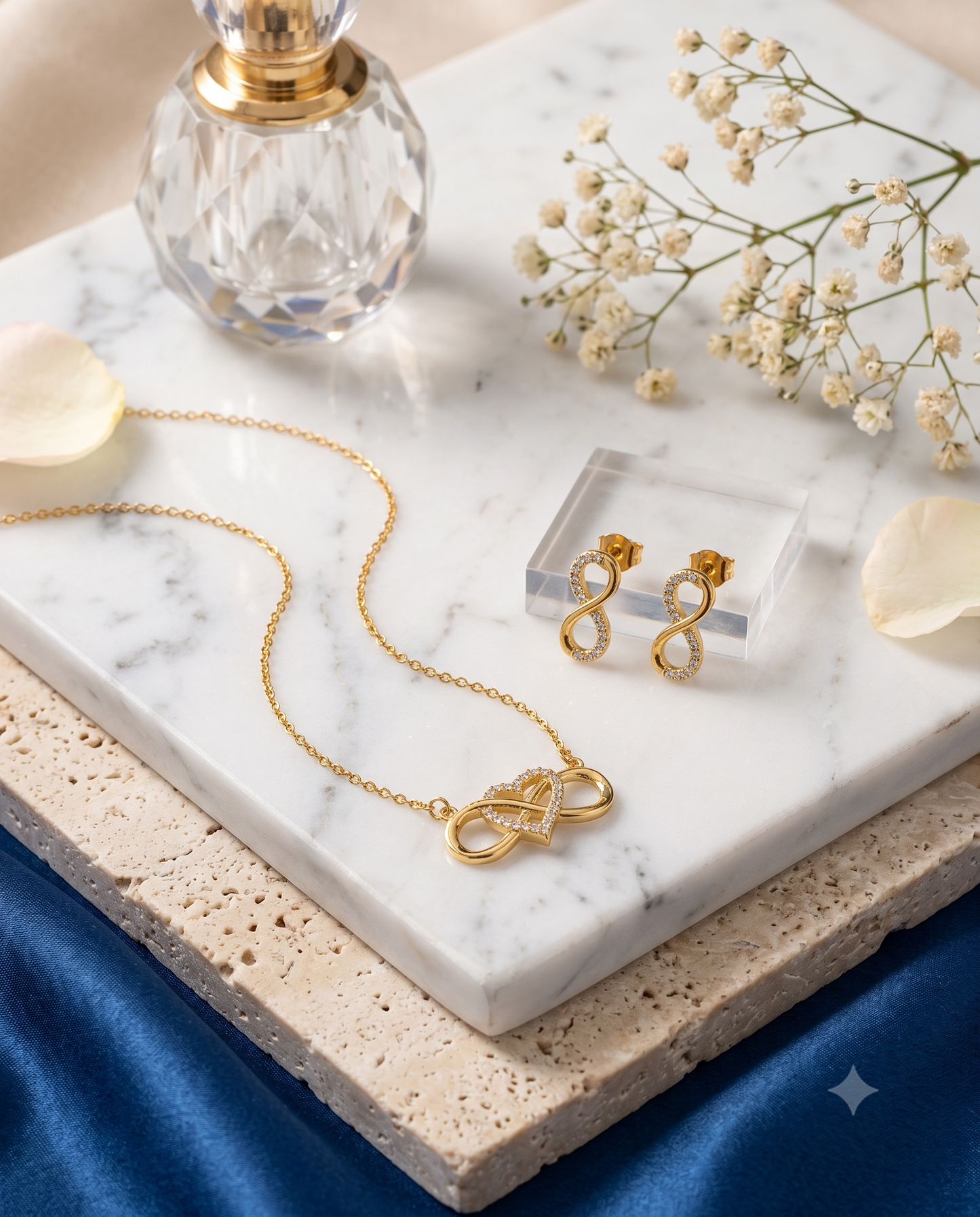 Heart accent infinity pendant necklace and matching stud earrings set, 18K gold plated – styled on jewelry stand