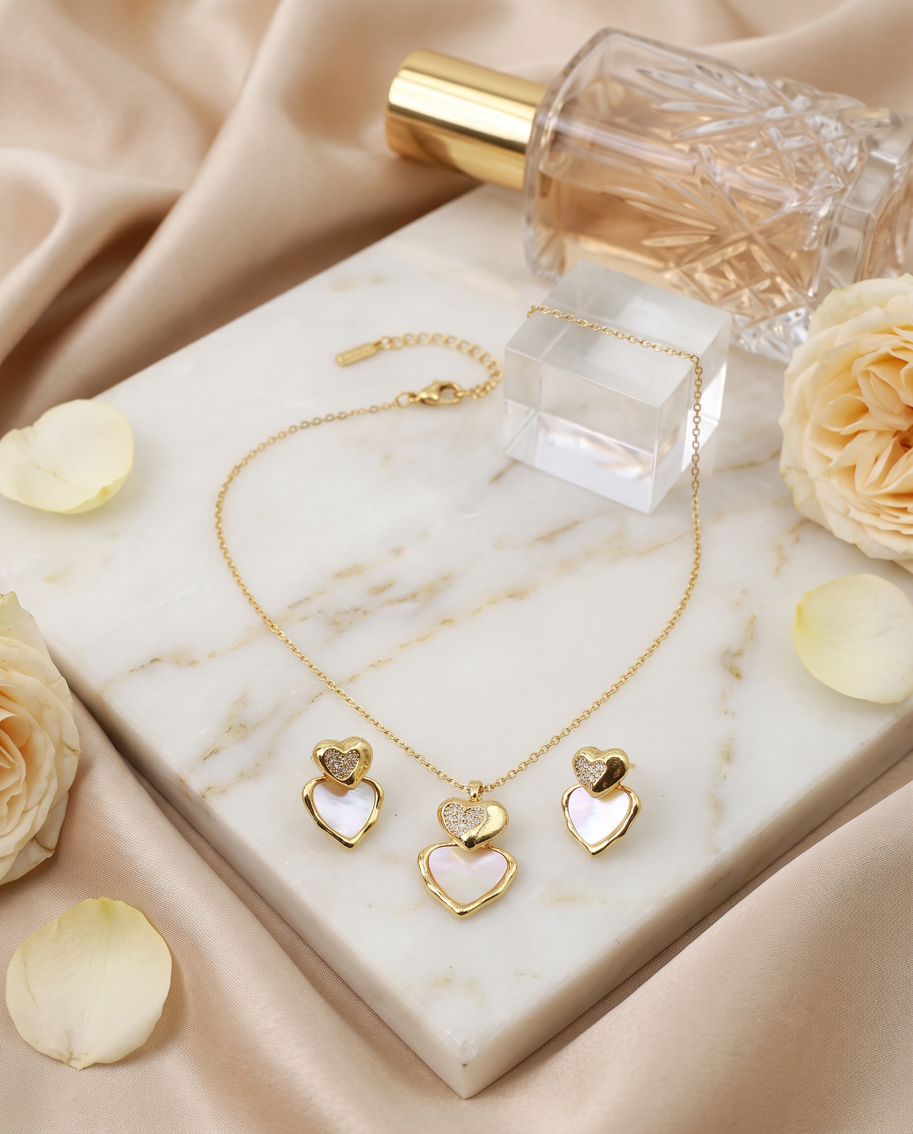 Heart pendant necklace and matching heart stud earrings set, 18K gold plated – styled on jewelry stand