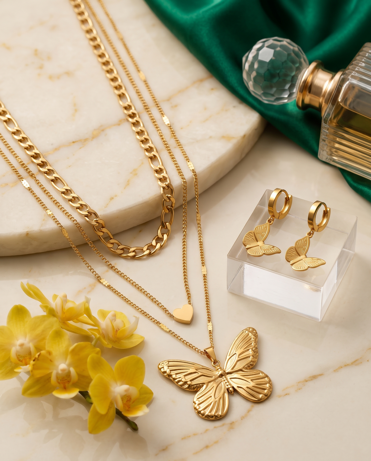Layered butterfly pendant necklace and matching butterfly earrings set, 18K gold plated – styled on jewelry stand