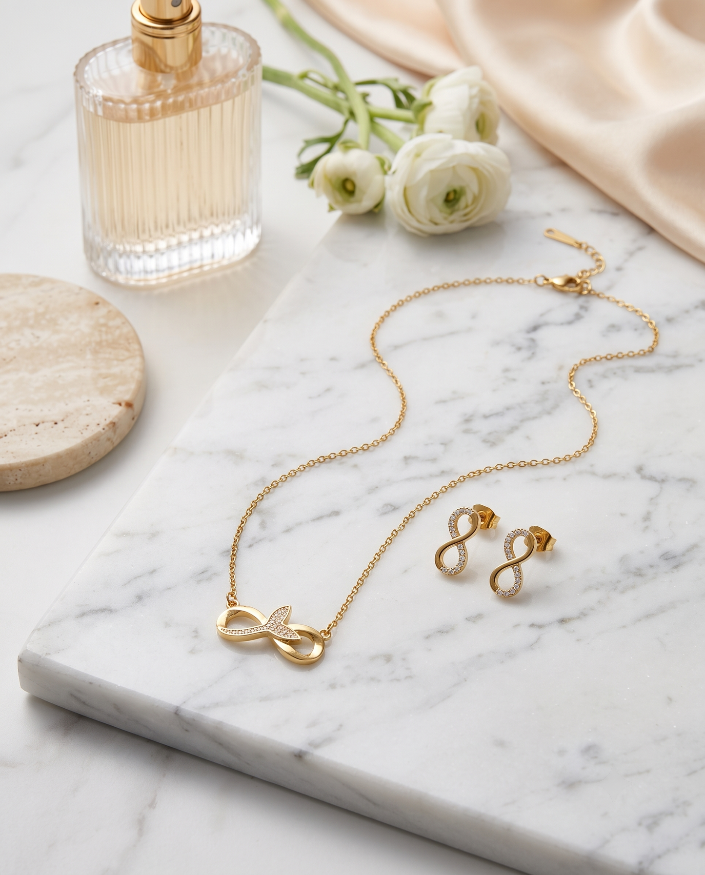 Infinity pendant necklace and matching zircon earrings set, 18K gold plated – worn styled shot