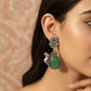 Temple Cow Motif Teardrop Earrings with Green Monalisa | Oxidised German Silver