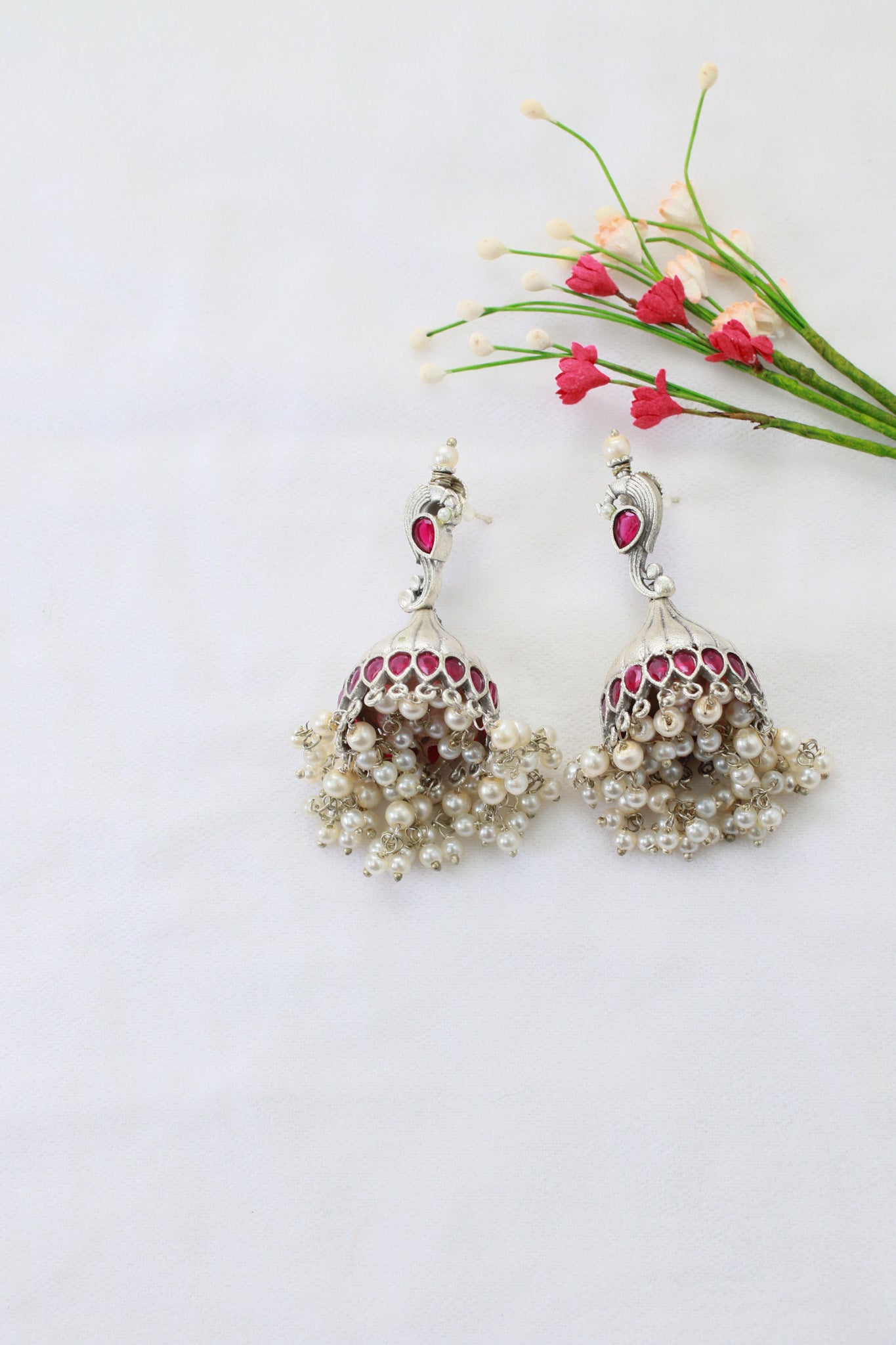 Ruby Red Jhumka Earrings in Oxidised German Silver with Pearl Tassels