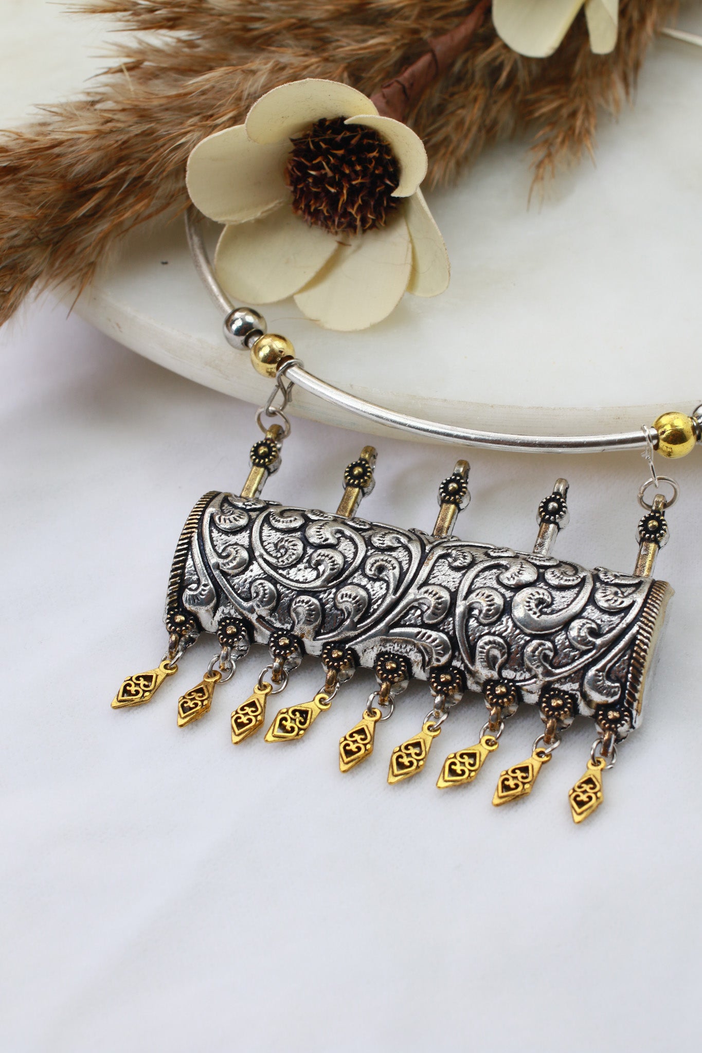 Dual Tone Oxidised German Silver Cylindrical Carved Hansuli Necklace