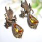 Silver-Tone Phoenix Earrings with Yellow Drop