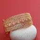 Grand Gold Bracelet with Pink Stones and CZ Detailing