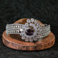 Elegant Silver Bracelet with Purple Floral Centerpiece
