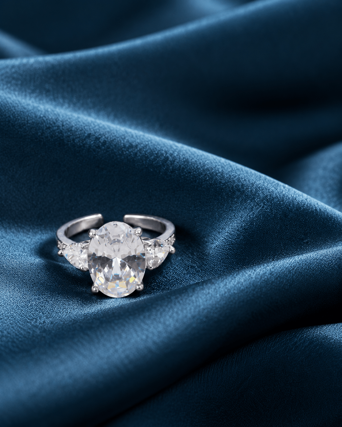 Clear Oval Three-Stone Ring with Heart Side Stones - Maxiblink