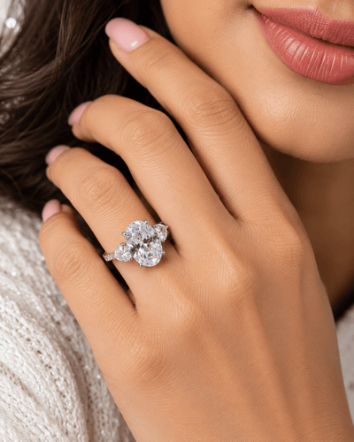 Clear Oval Three-Stone Ring with Heart Side Stones - Maxiblink