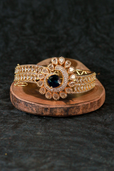 Gold Bracelet with Peacock Design and Blue Stone - Maxiblink