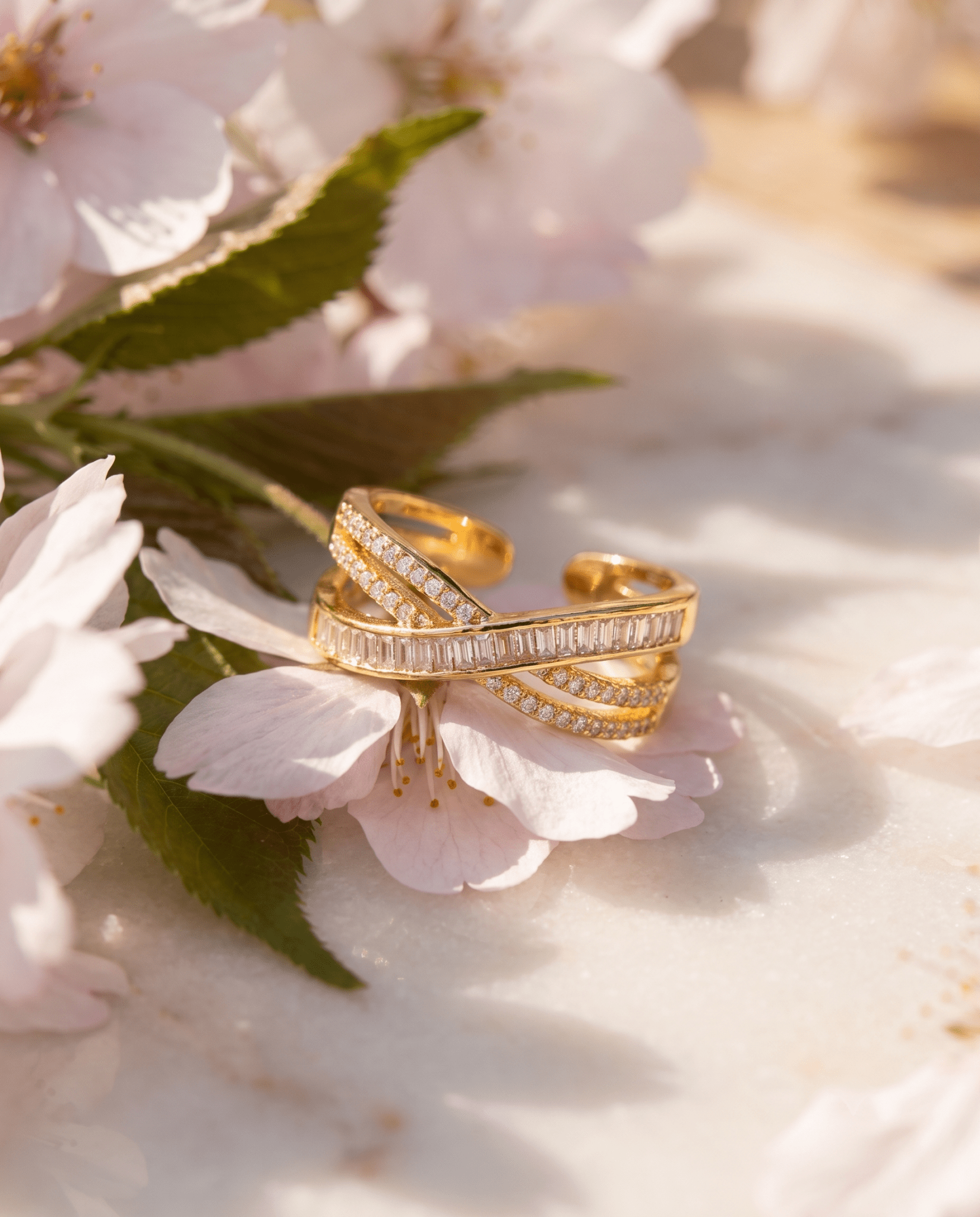 gold-plated baguette ring — Triple-Line Baguette Crossover Ring by MaxiBlink